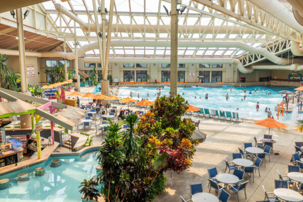 Gallery image of Wild Waterdome Indoor Waterpark over view of Margarita's swim-up bar with the Great Wave indoor wave pool in background.