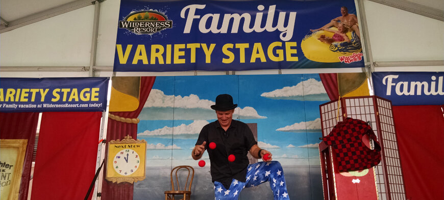 man juggling at the wisconsin state fair at the wilderness variety stage