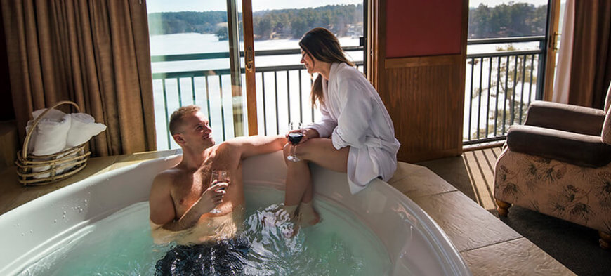 couple in a got tub at wilderness at the lake